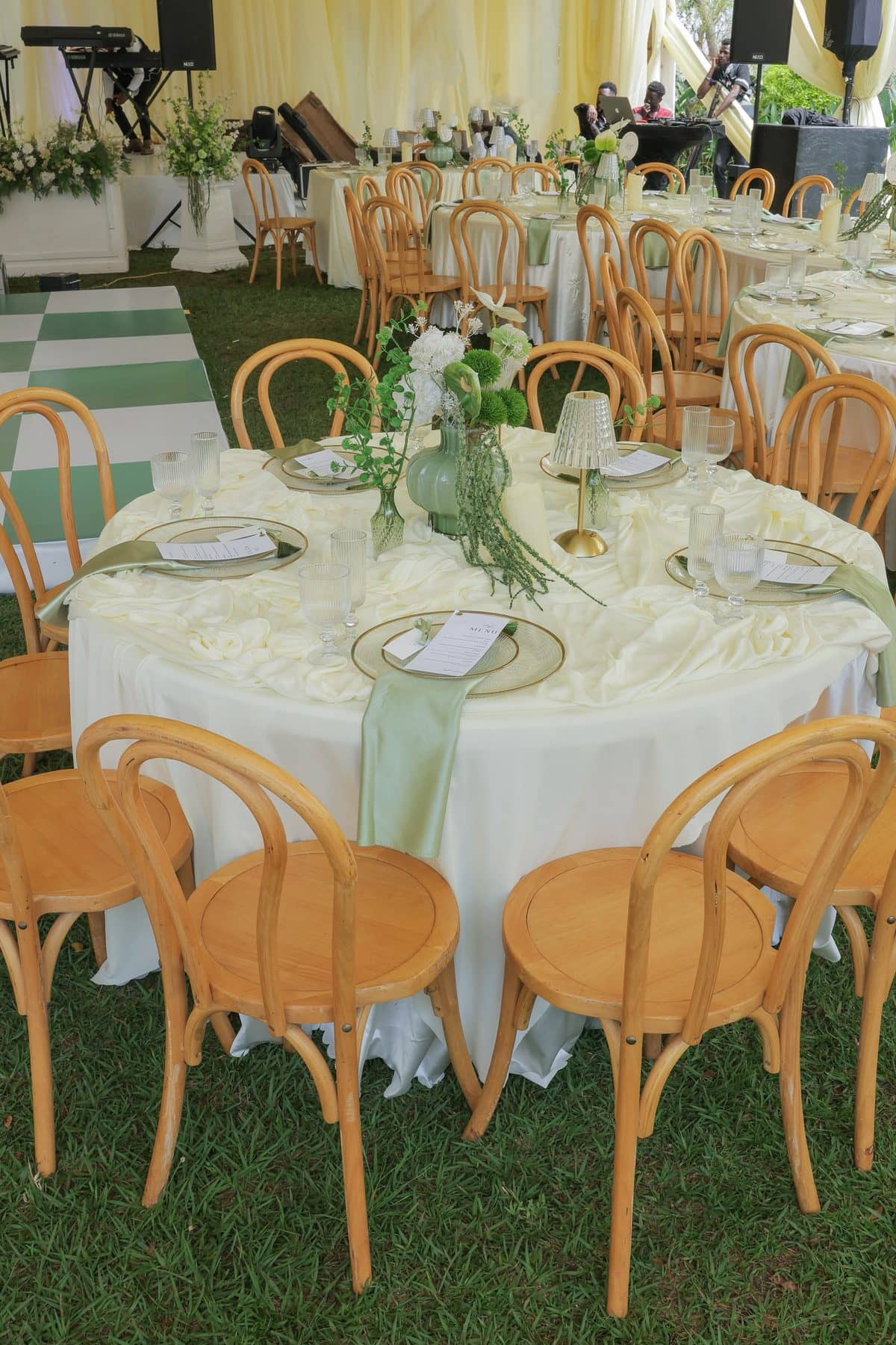 Bentwood chairs and linen-draped rounds