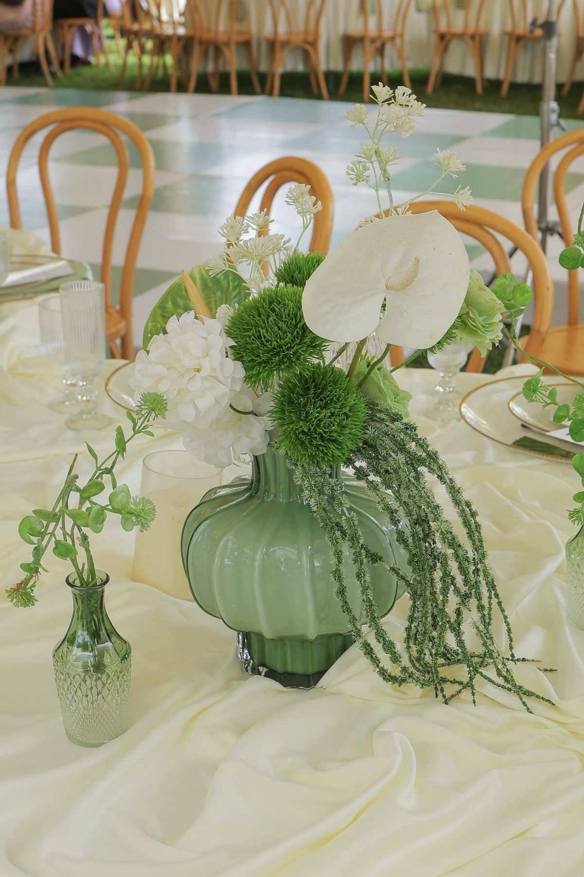 Sage glass, anthuriums and trailing greens