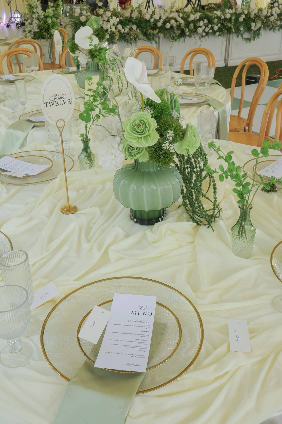 Gold-rimmed chargers and hand-lettered menus