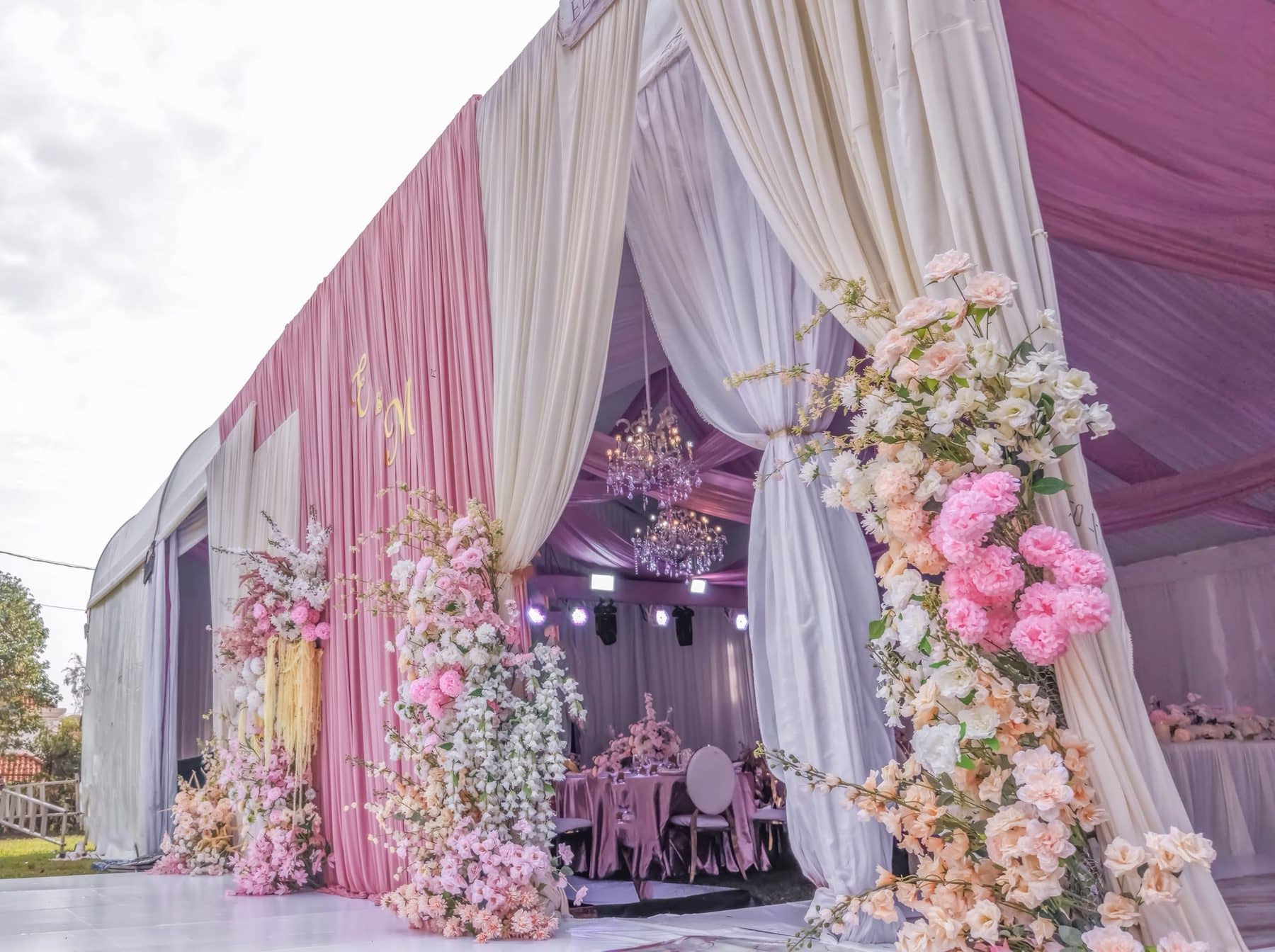 A floral entrance into the marquee